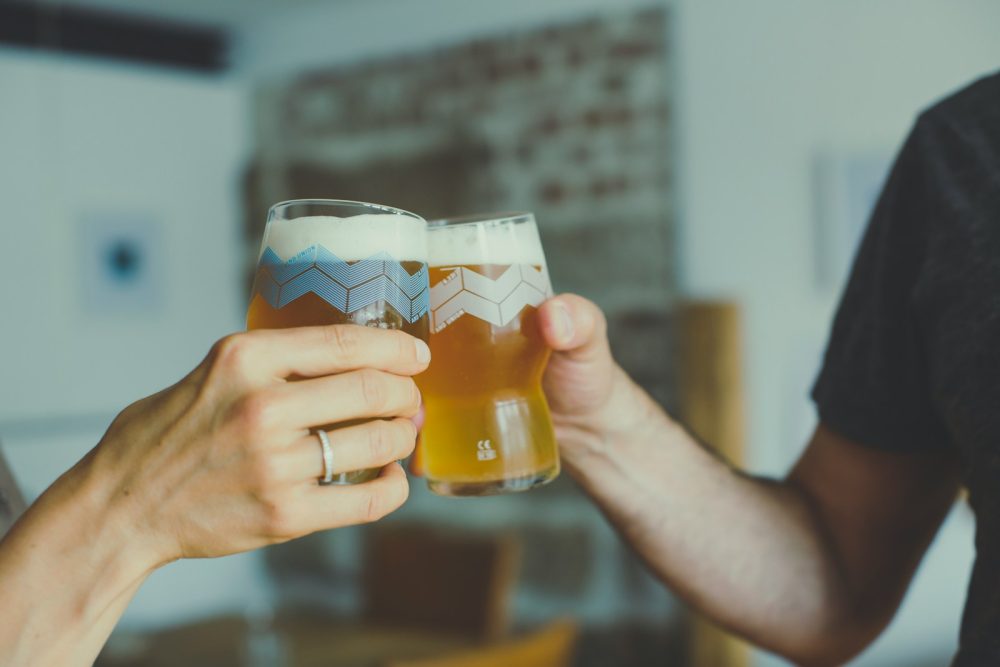 Photo by Markus Spiske a couple of people that are holding some glasses